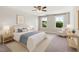 Stylized bedroom featuring a queen bed, chair and side tables and neutral carpet at 1600 Drift Falls Ln, Wendell, NC 27591