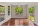 Bright breakfast nook with hardwood floors and views of the outdoor landscape at 1600 Drift Falls Ln, Wendell, NC 27591