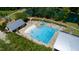 Aerial view of the community pool with a splash pad, slide and ample seating at 1600 Drift Falls Ln, Wendell, NC 27591