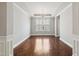Elegant dining room with hardwood floors, recessed lighting, and tray ceiling at 1600 Drift Falls Ln, Wendell, NC 27591