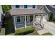 An elevated view of home's exterior highlights the inviting front porch and attached two car garage at 1600 Drift Falls Ln, Wendell, NC 27591