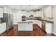 Eat-in kitchen with granite countertops, stainless steel appliances, and an island, offering a chef's delight at 1600 Drift Falls Ln, Wendell, NC 27591