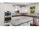 Bright kitchen with granite countertops, stainless steel appliances, and ample cabinet space at 1600 Drift Falls Ln, Wendell, NC 27591