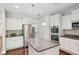 Contemporary kitchen with stainless steel appliances, ample counter space, and a kitchen island at 1600 Drift Falls Ln, Wendell, NC 27591
