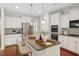 Modern kitchen featuring a center island with seating and stainless steel appliances at 1600 Drift Falls Ln, Wendell, NC 27591