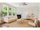 Inviting living room with hardwood floors, neutral decor, and a cozy fireplace at 1600 Drift Falls Ln, Wendell, NC 27591