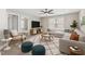 Comfortable living room with plush seating, stylish rug, and a modern entertainment center at 1600 Drift Falls Ln, Wendell, NC 27591
