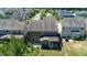 Backyard view featuring a screened porch, patio, and well-maintained lawn, perfect for outdoor relaxation at 1600 Drift Falls Ln, Wendell, NC 27591