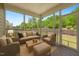Relaxing screened porch with comfortable seating, perfect for outdoor enjoyment at 1600 Drift Falls Ln, Wendell, NC 27591