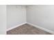 Neutral-toned walk-in closet features soft carpeting and minimalist design at 1600 Drift Falls Ln, Wendell, NC 27591