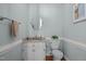 Powder room features blue walls, vanity, and granite countertop at 18 Acornridge Ct, Durham, NC 27707