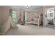 bedroom with a bunk bed, teepee, and view of the backyard at 18 Acornridge Ct, Durham, NC 27707