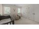 Bedroom with a crib and neutral-toned swivel chair, providing a cozy space at 18 Acornridge Ct, Durham, NC 27707