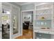 Hallway with view of sunroom and living room at 18 Acornridge Ct, Durham, NC 27707