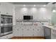 Close-up of white cabinets, stainless appliances and granite counters at 18 Acornridge Ct, Durham, NC 27707