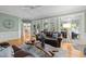 Spacious living room showcases fireplace, hardwood floors, and view of the dining area at 18 Acornridge Ct, Durham, NC 27707
