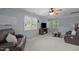 Living room featuring a ceiling fan, two sofas and entertainment center at 18 Acornridge Ct, Durham, NC 27707