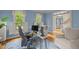 Well-lit office space with hardwood floors and custom window shutters at 18 Acornridge Ct, Durham, NC 27707