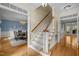 Elegant staircase connects to an open dining room, perfect for entertaining at 18 Acornridge Ct, Durham, NC 27707