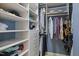 A well-organized walk-in closet with custom shelving, drawers, and hanging space for clothes and accessories at 18 Acornridge Ct, Durham, NC 27707