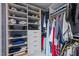 A well-organized walk-in closet with custom shelving, drawers, and hanging space for clothes and accessories at 18 Acornridge Ct, Durham, NC 27707