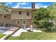 Backyard of the house features a brick and siding exterior, trees, grass, a fire pit, and seating at 1920 Hillock Dr, Raleigh, NC 27612