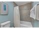 Clean bathroom featuring a tub with tiled surround and shower curtain at 1920 Hillock Dr, Raleigh, NC 27612