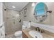 Bright bathroom with a tiled shower, granite countertop vanity, and a window for plenty of natural light at 1920 Hillock Dr, Raleigh, NC 27612
