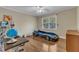 Bedroom with wood flooring and a race car-themed bed that will delight any young car enthusiast at 1920 Hillock Dr, Raleigh, NC 27612