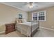 Cozy bedroom with neutral carpet, light walls, and a metal bed frame at 1920 Hillock Dr, Raleigh, NC 27612