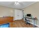 Bedroom boasting vinyl flooring and a desk area; perfect for studying, hobbies, or creative endeavors at 1920 Hillock Dr, Raleigh, NC 27612