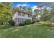Angle shot of house with light colored stucco siding and green grass at 1920 Hillock Dr, Raleigh, NC 27612