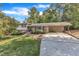 Charming home featuring a carport and a lush green lawn at 1920 Hillock Dr, Raleigh, NC 27612