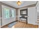 Hardwood flooring compliments foyer with a black accent table at 1920 Hillock Dr, Raleigh, NC 27612