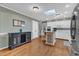 Bright kitchen boasting hardwood floors, white cabinetry, an island and stainless steel appliances at 1920 Hillock Dr, Raleigh, NC 27612