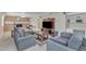 Spacious living room with a comfortable seating area, fireplace, and built-in features at 1920 Hillock Dr, Raleigh, NC 27612