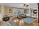 Cozy living room featuring a ceiling fan and hardwood flooring at 1920 Hillock Dr, Raleigh, NC 27612