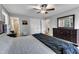 Comfortable main bedroom with a large bed, wood floors, a dresser, and access to an attached bathroom at 1920 Hillock Dr, Raleigh, NC 27612