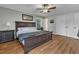 Spacious main bedroom with a large bed, two windows, and two closets for ample storage at 1920 Hillock Dr, Raleigh, NC 27612