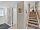Carpeted staircase with white walls and artwork at 1920 Hillock Dr, Raleigh, NC 27612