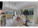 Bright workout room with tiled floors and many windows features stationary bikes and weights at 1920 Hillock Dr, Raleigh, NC 27612