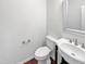 Cozy powder room featuring a sleek vanity and a modern toilet at 2072 Tanners Mill Dr, Durham, NC 27703