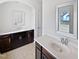 Bathroom featuring double sinks with dark cabinets and a white countertop at 2072 Tanners Mill Dr, Durham, NC 27703