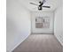 This bedroom is carpeted and features a window with a view and a ceiling fan at 2072 Tanners Mill Dr, Durham, NC 27703