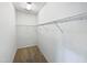 This walk-in closet features wire shelving and neutral carpeting at 2072 Tanners Mill Dr, Durham, NC 27703