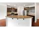 Open kitchen features granite countertops, stainless steel appliances, and ample cabinet space at 2072 Tanners Mill Dr, Durham, NC 27703