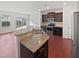 Modern kitchen boasts granite countertops, a stainless steel sink, and black appliances at 2072 Tanners Mill Dr, Durham, NC 27703