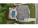 Birds eye view of a luxury property featuring a pool, lounge area, and manicured landscaping at 2077 Amalfi Pl, Apex, NC 27502