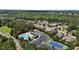 Community featuring lush landscaping, community pool, clubhouse, and tennis court at 2077 Amalfi Pl, Apex, NC 27502