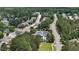 Neighborhood view of lush landscaping, tennis court, community pool, and roadways at 2077 Amalfi Pl, Apex, NC 27502